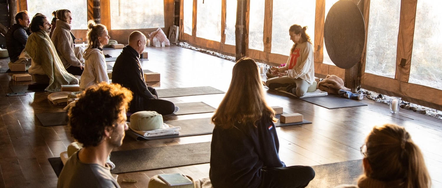 students listening to teacher explaining during a retreat